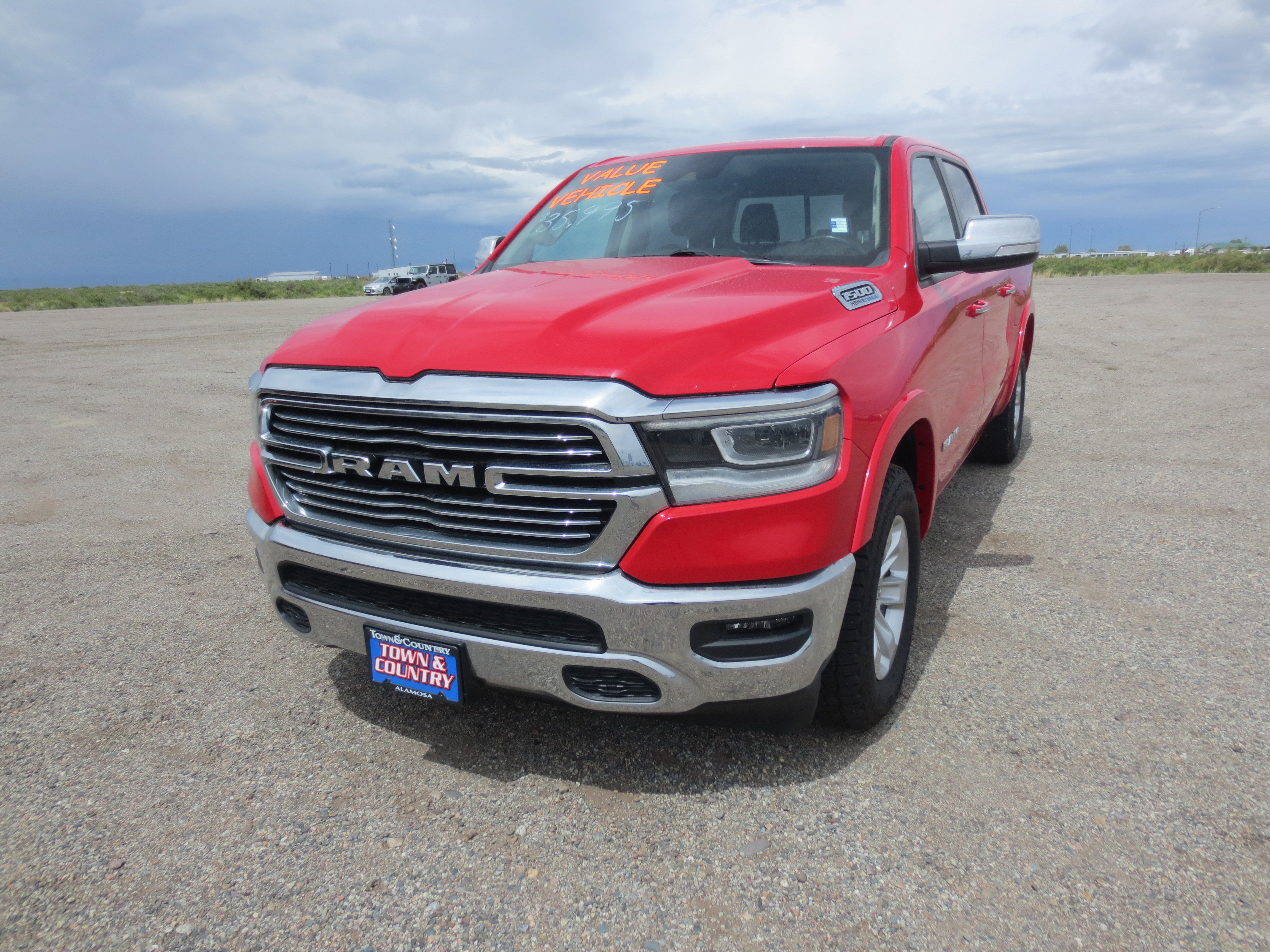 2022 RAM 1500 Laramie in Red — front three-quarter view