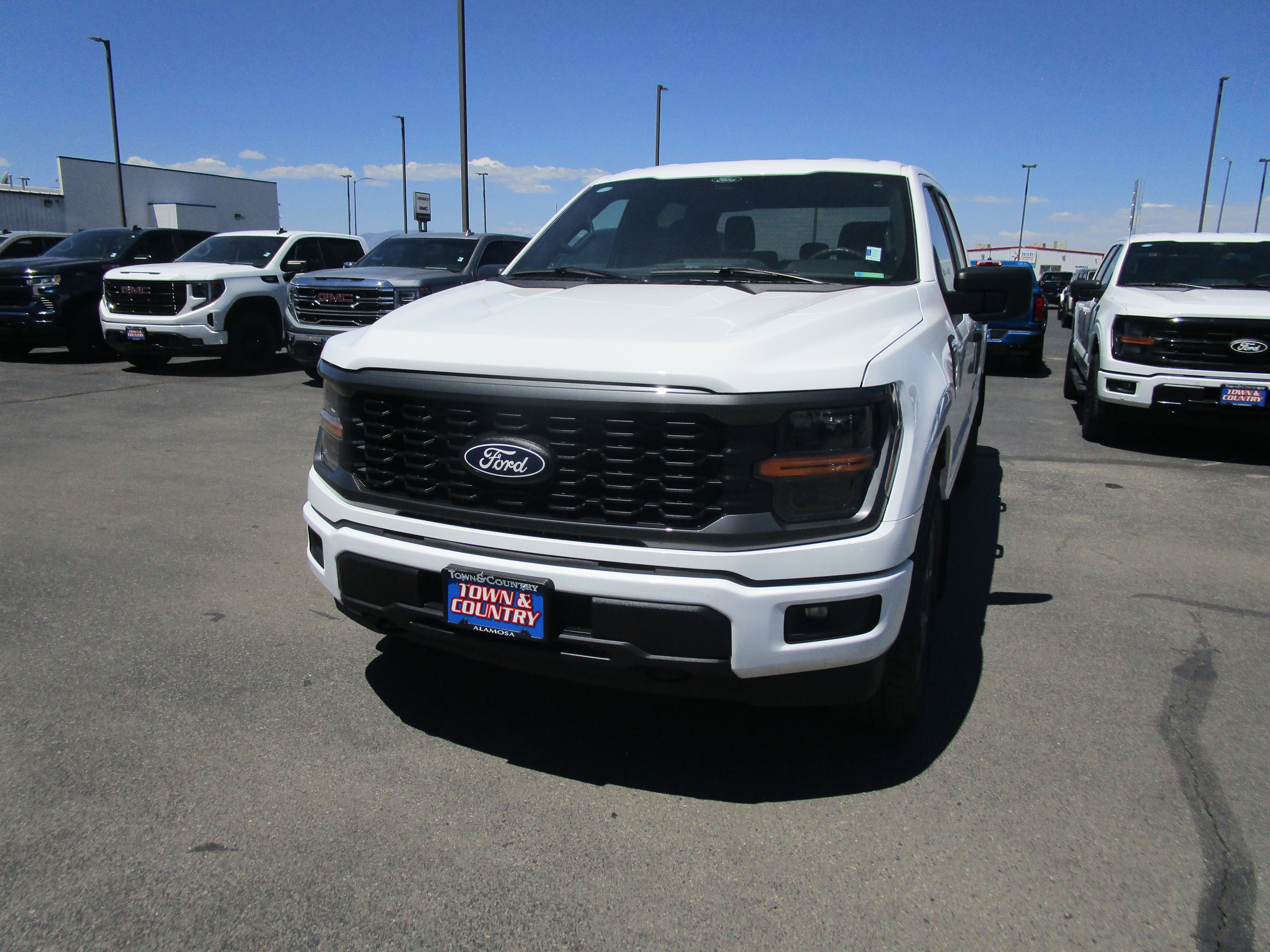 2024 Ford F-150 STX in White — front three-quarter view