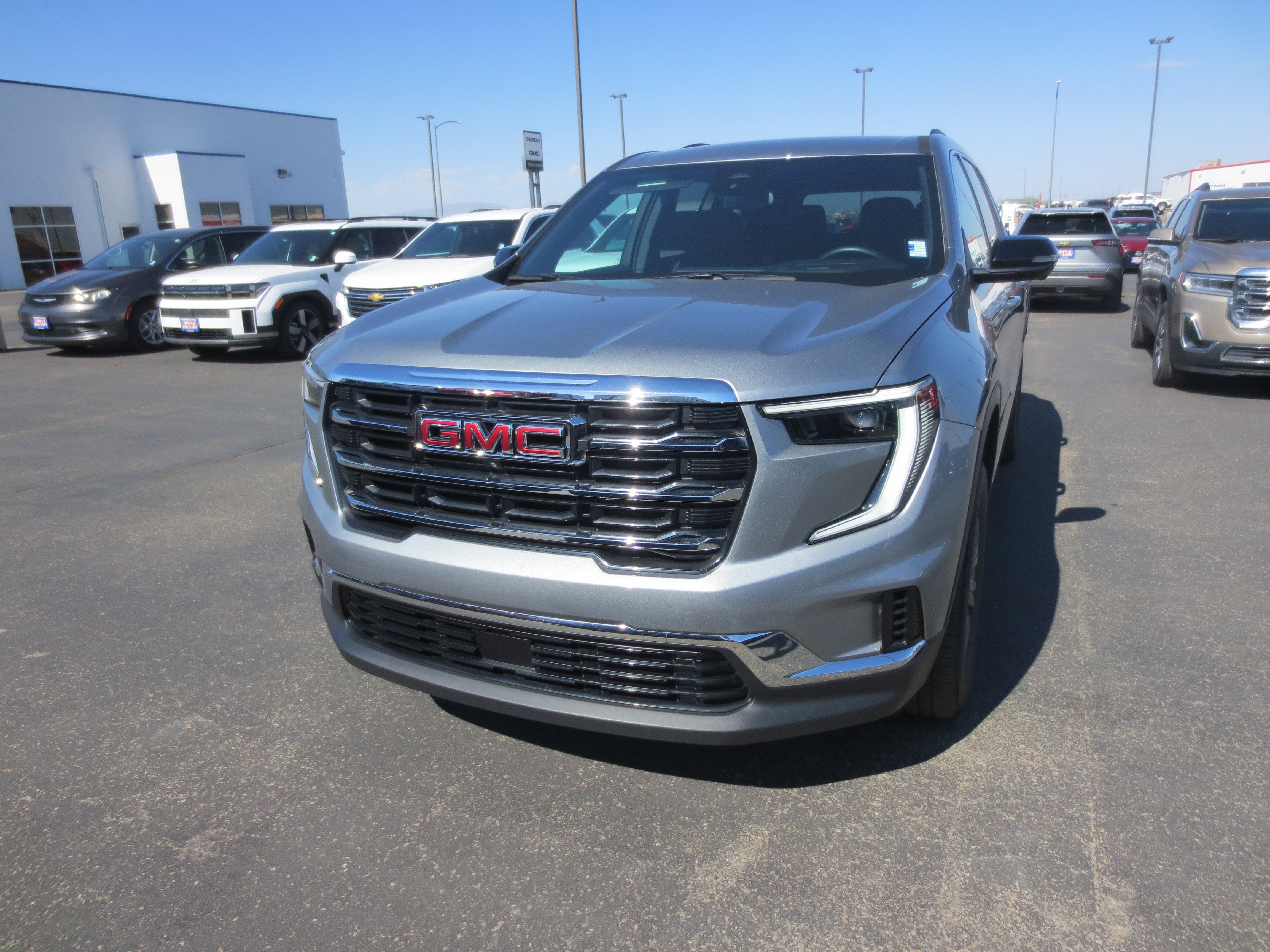 2025 GMC Acadia Elevation in Sterling Metallic — front three-quarter view