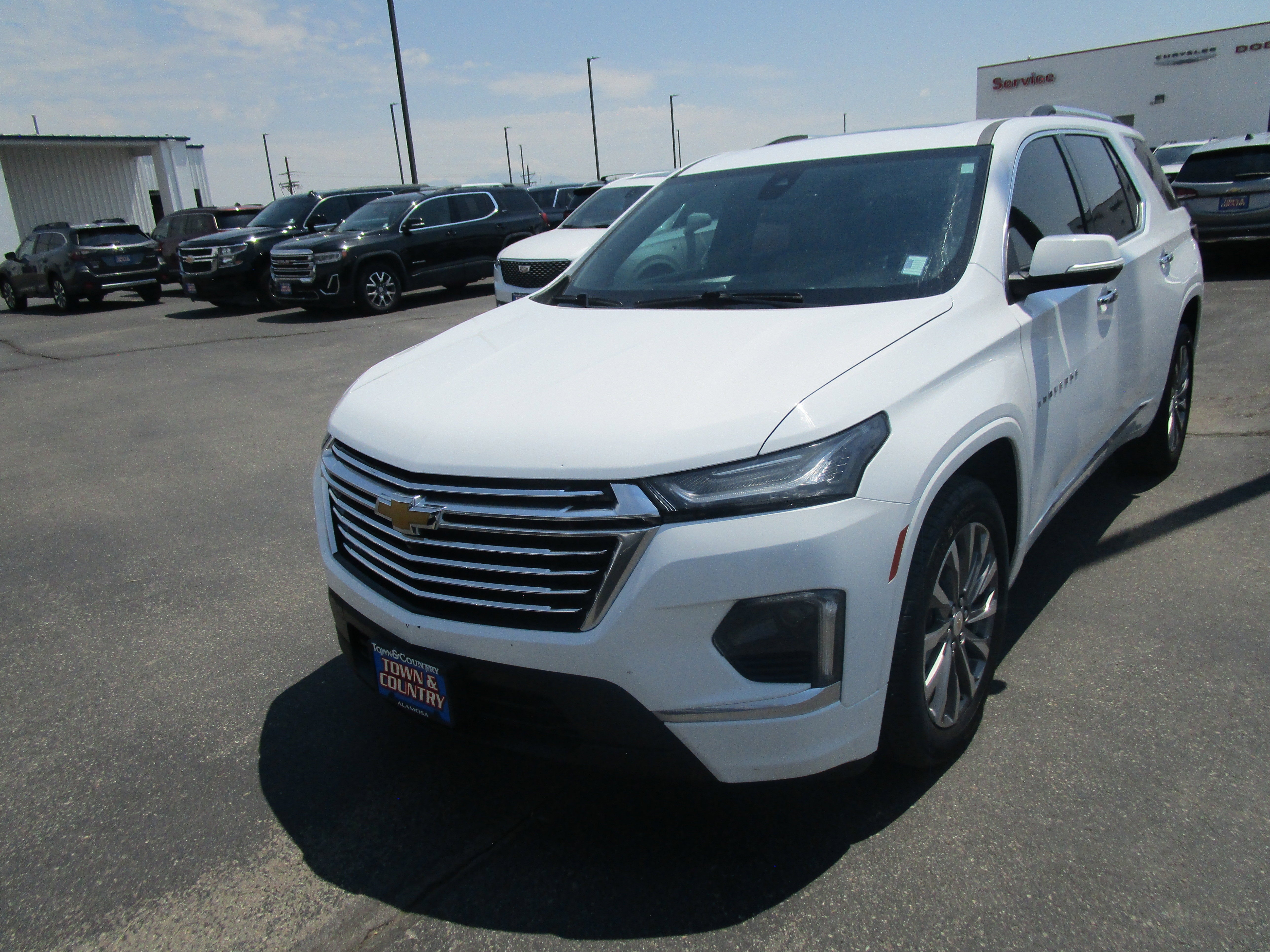 2023 Chevrolet Traverse Premier in Summit White — front three-quarter view