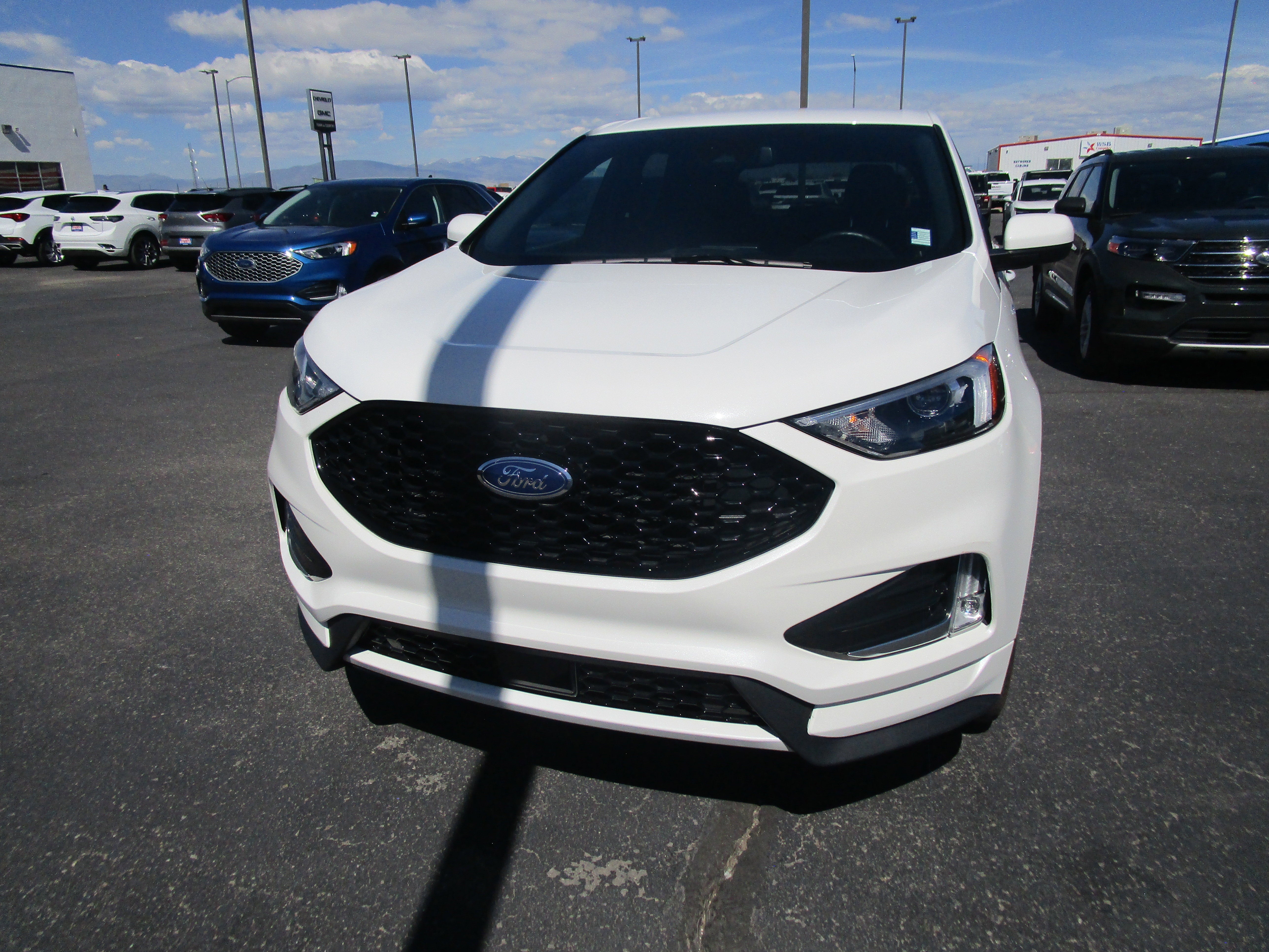2024 Ford Edge SEL in White — front three-quarter view