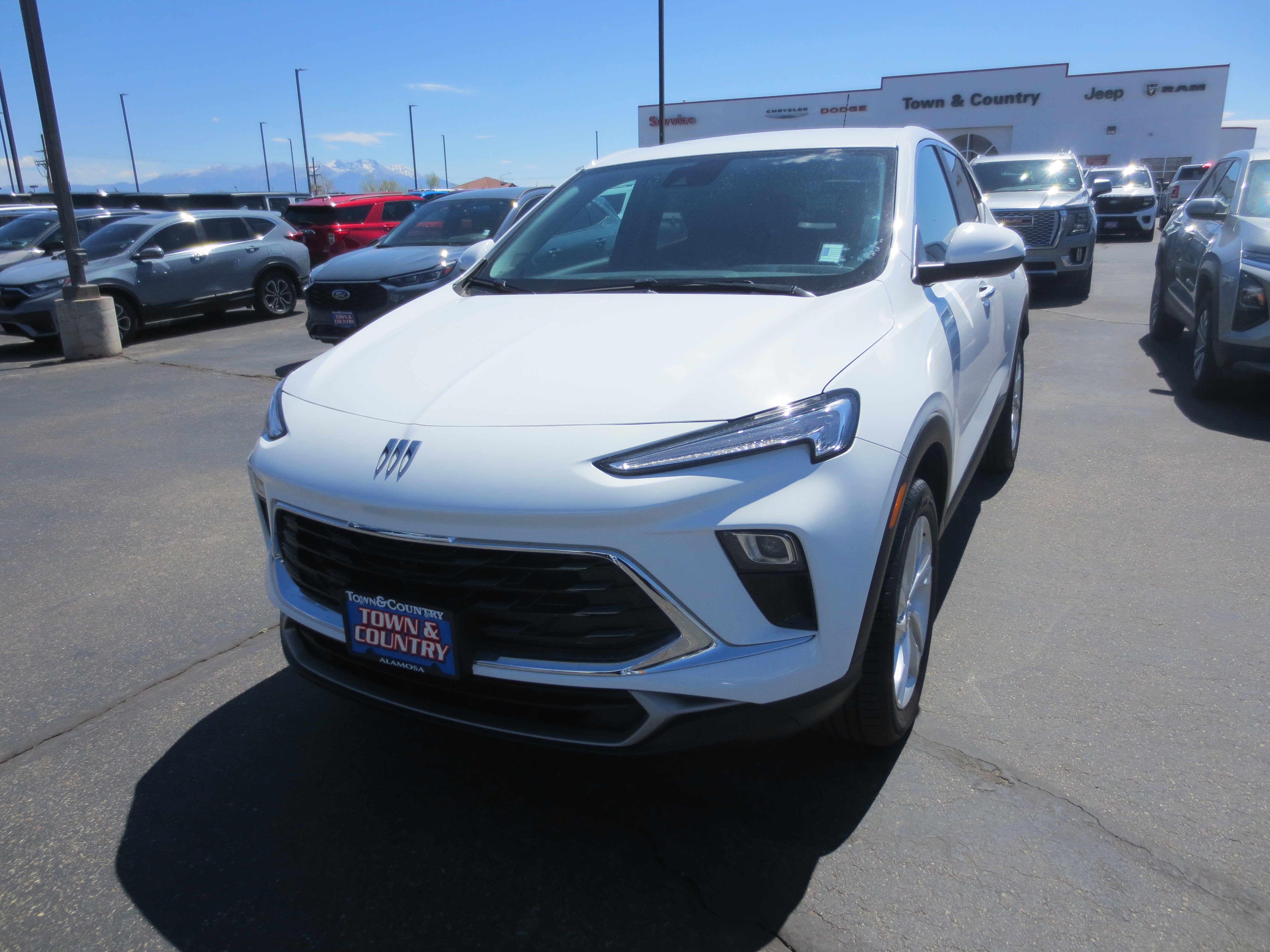 2025 Buick Encore GX Preferred in Summit White — front three-quarter view