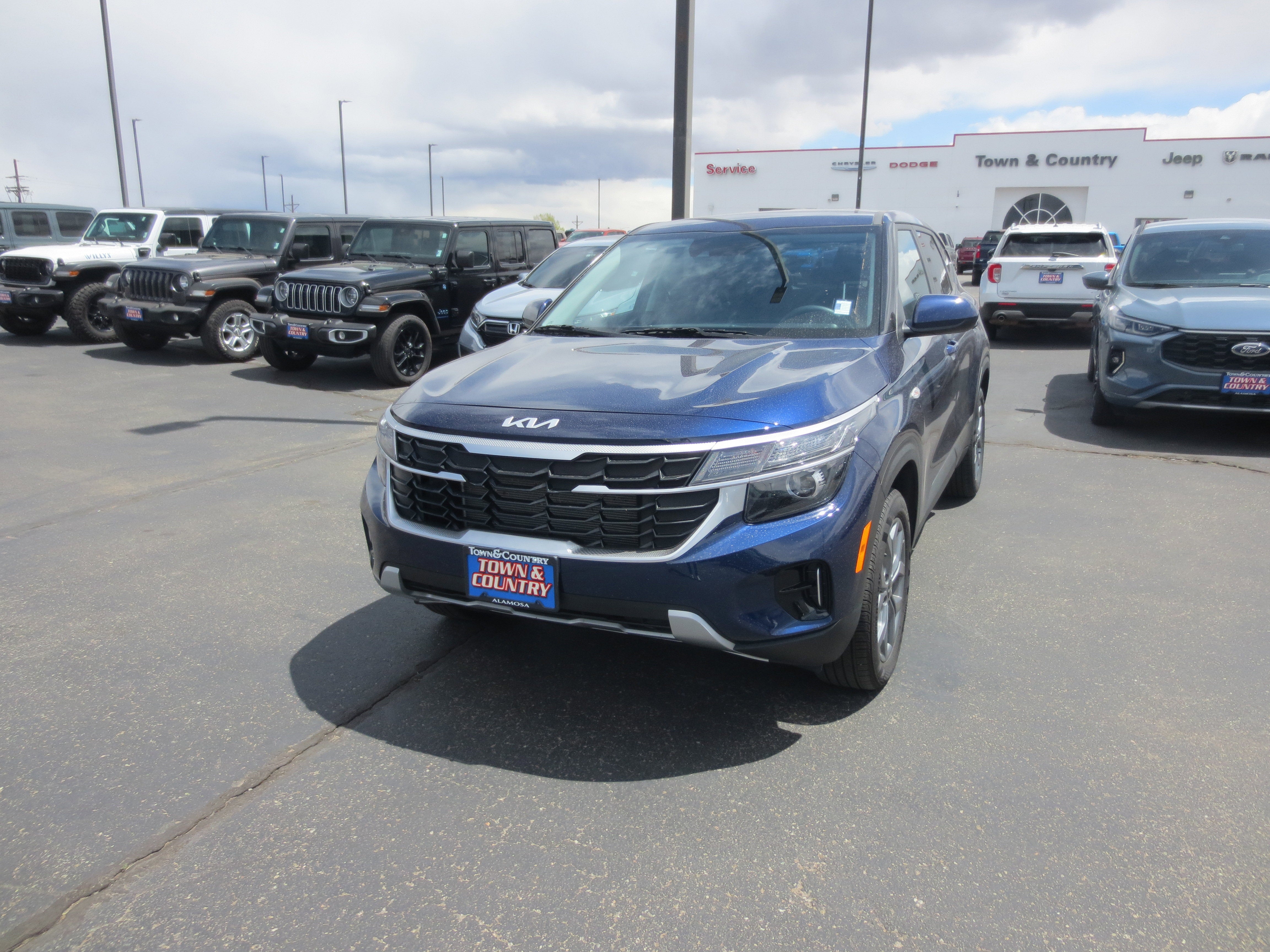 2026 Kia Seltos LX in Blue — front three-quarter view